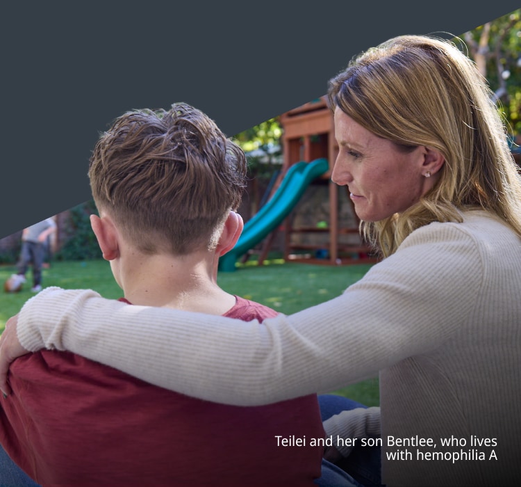 Image of woman with arm around teenage son